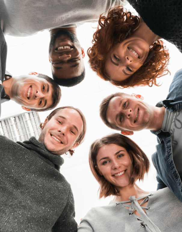 Group of people in a circle looking down